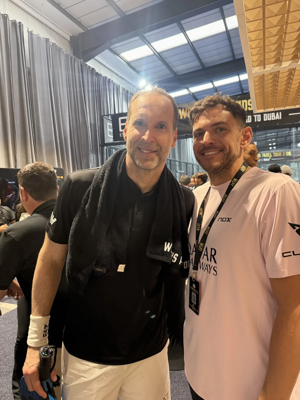Petr Cech, towel around his neck after playing, with a member of the PadX and Genius Digital Labs team at the courtside.