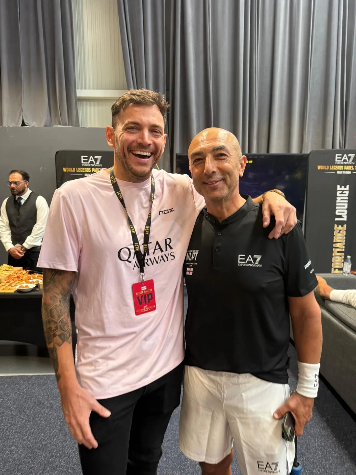 Roberto Di Matteo in EA7 kit with his arm around a member of the PadX and Genius Digital Labs team in the performance lounge.